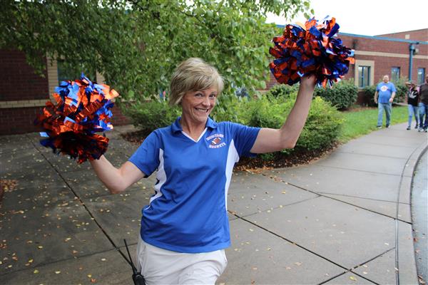 Dr. Finch school principal with pom poms